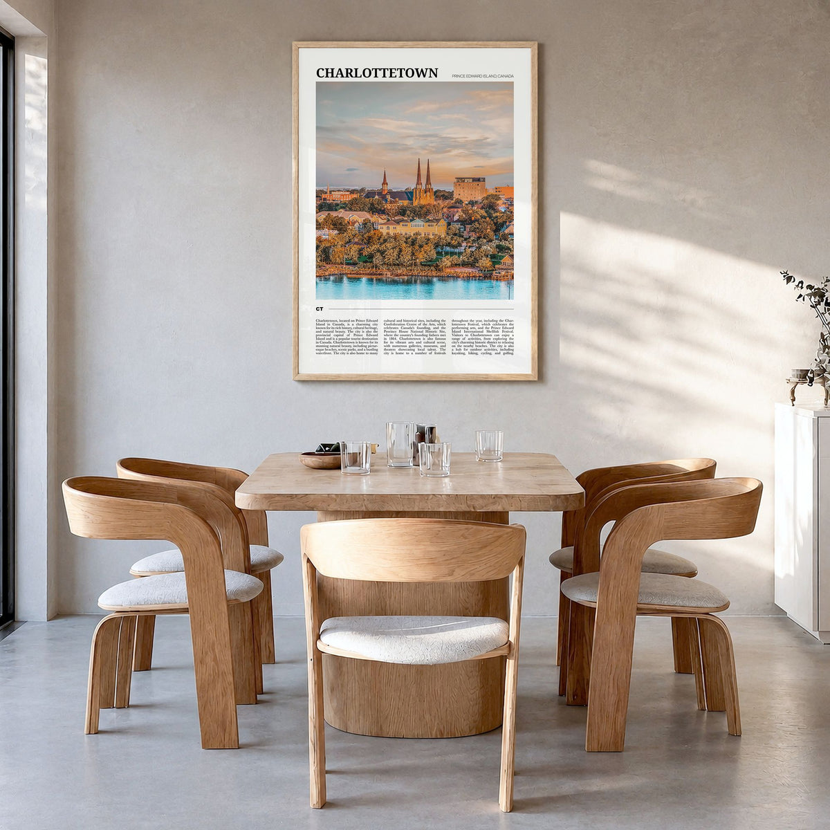 Charlottetown Travel Poster in a natural wood frame, hanging in a dining room