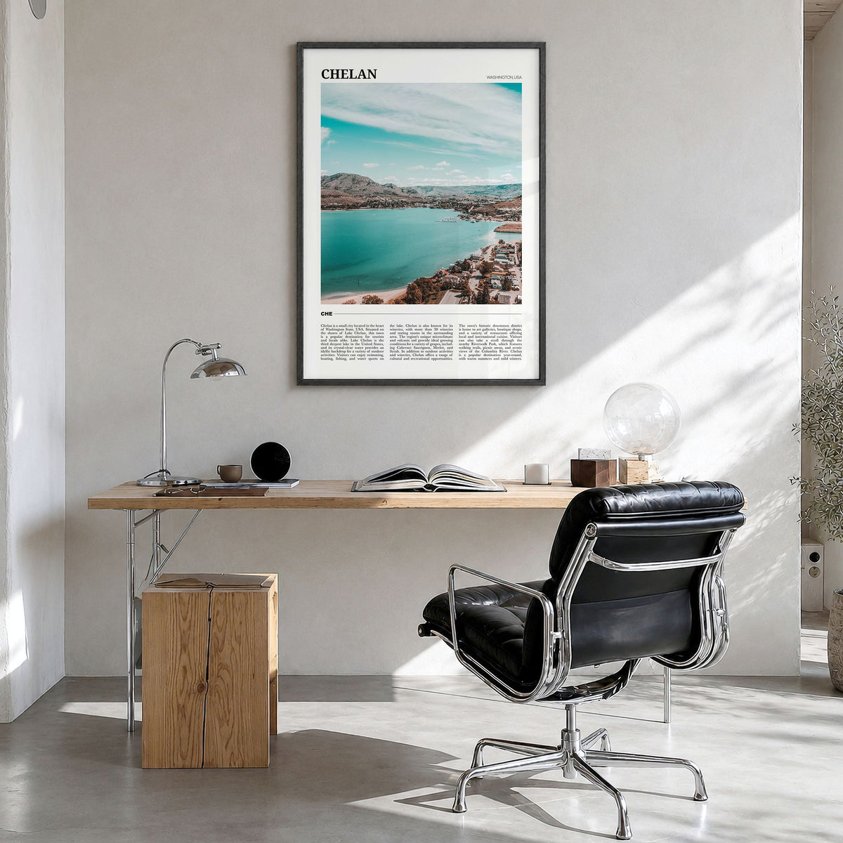 Chelan Travel Poster in a black wood frame, hanging in a bright home office