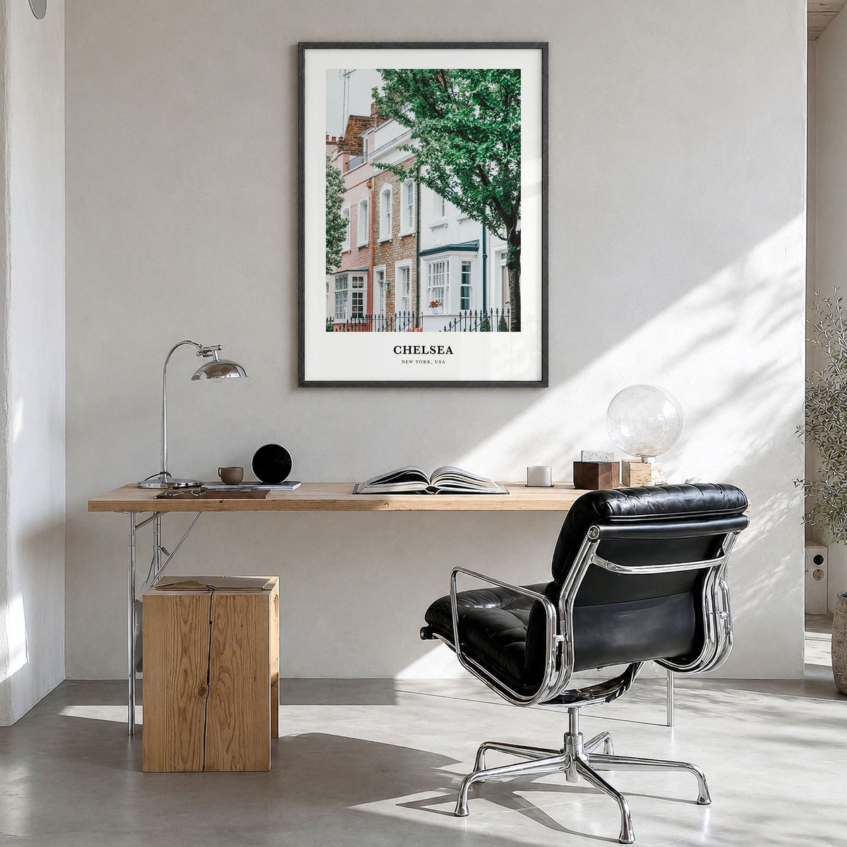 Chelsea, New York Classic Poster in a black wood frame, hanging in a bright home office