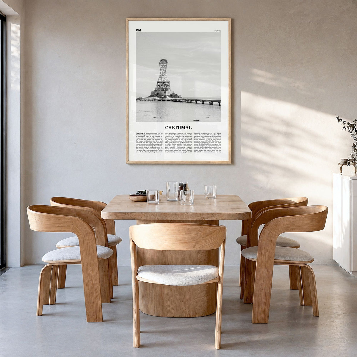 Chetumal Newspaper Poster in a natural wood frame, hanging in a dining room