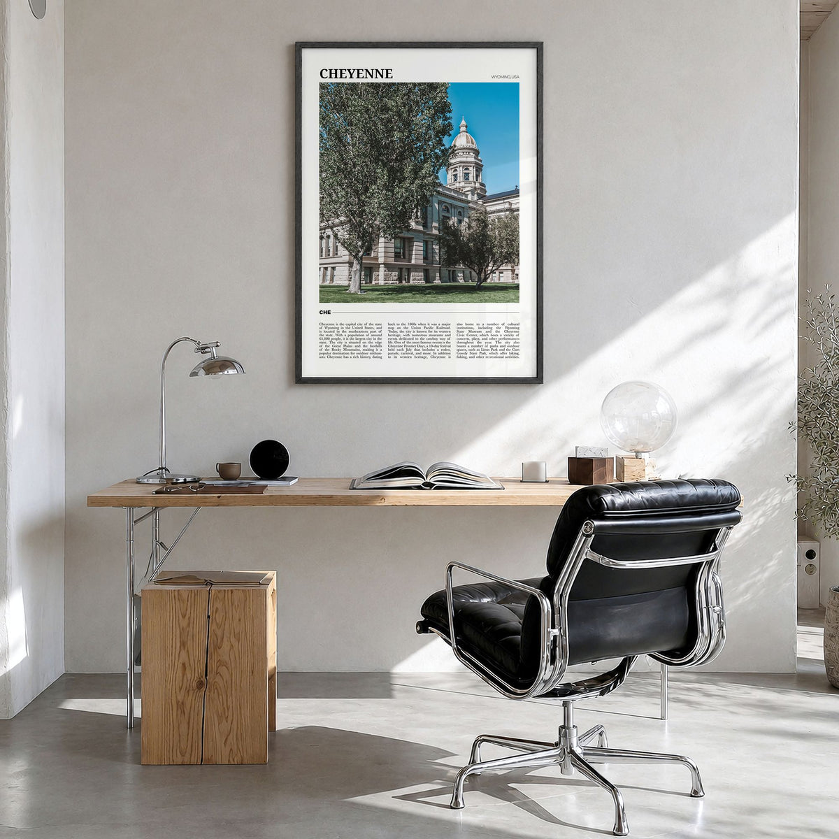 Cheyenne Travel Poster in a black wood frame, hanging in a bright home office