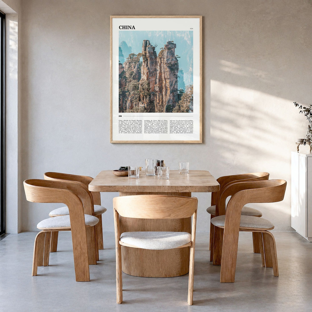 China Travel Poster in a natural wood frame, hanging in a dining room