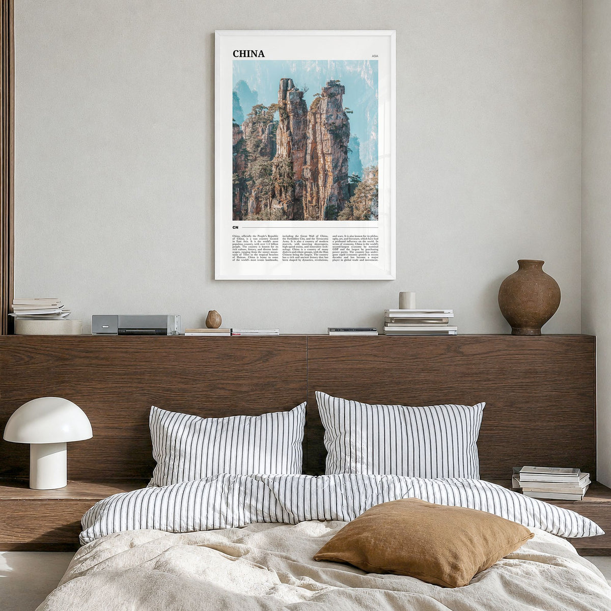 China Travel Poster in a white wood frame, hanging in a bedroom
