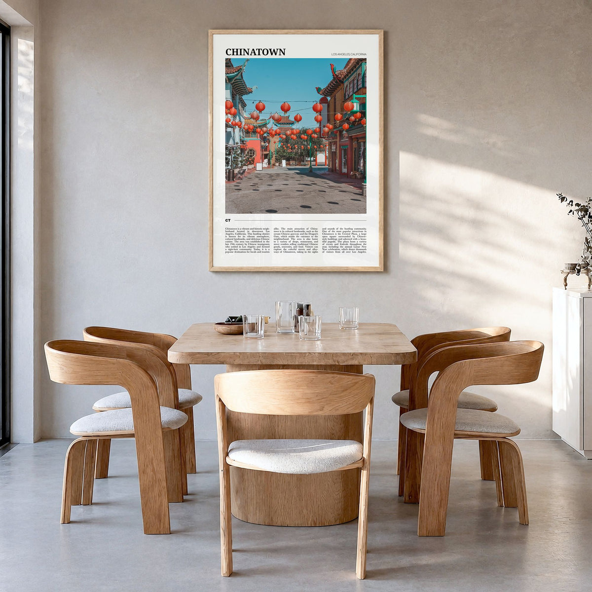 Chinatown, Los Angeles Travel Poster in a natural wood frame, hanging in a dining room