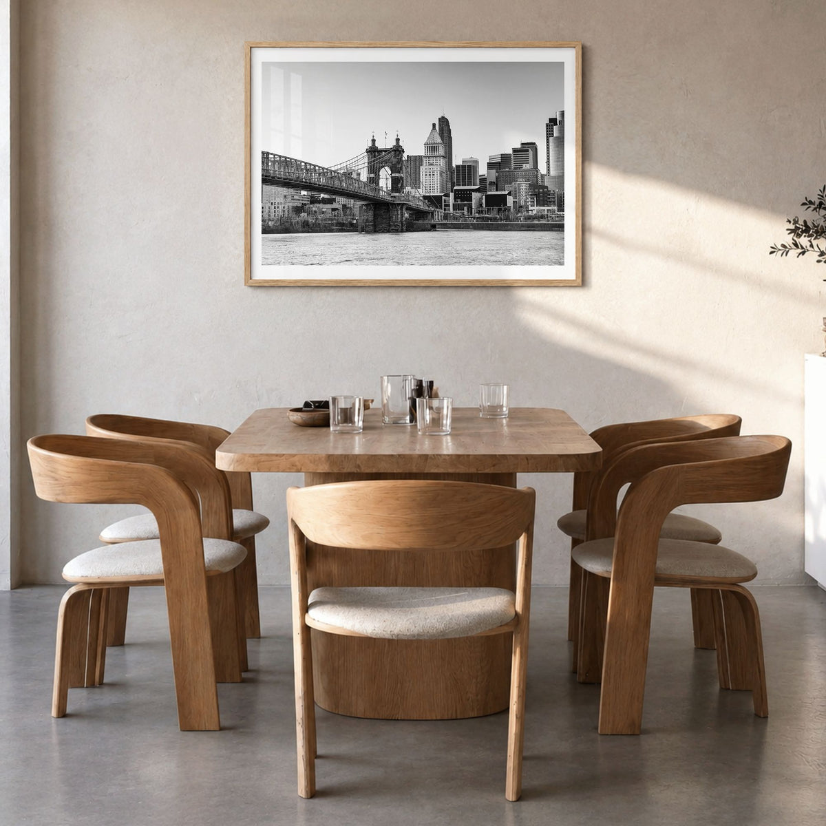 Cincinnati Photo Poster in a natural wood frame, hanging in a dining room, white border