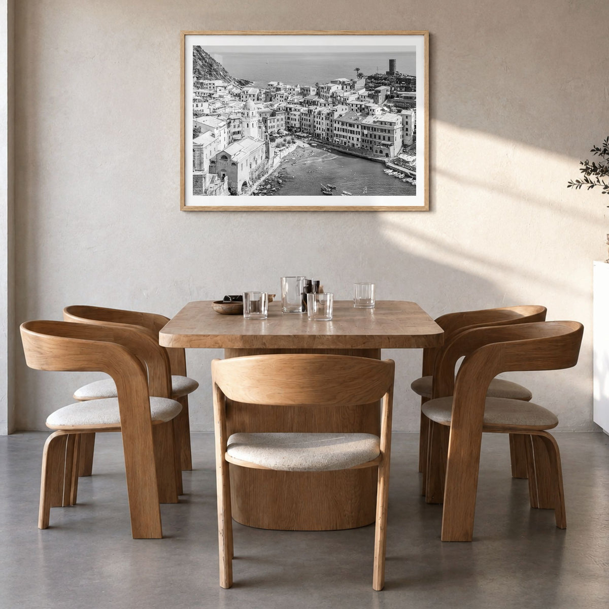 Cinque Terre Photo Poster in a natural wood frame, hanging in a dining room, white border