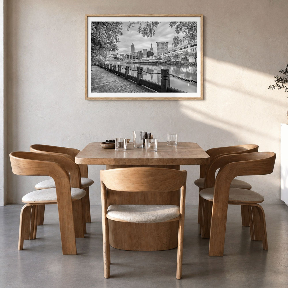 Cleveland Photo Poster in a natural wood frame, hanging in a dining room, white border