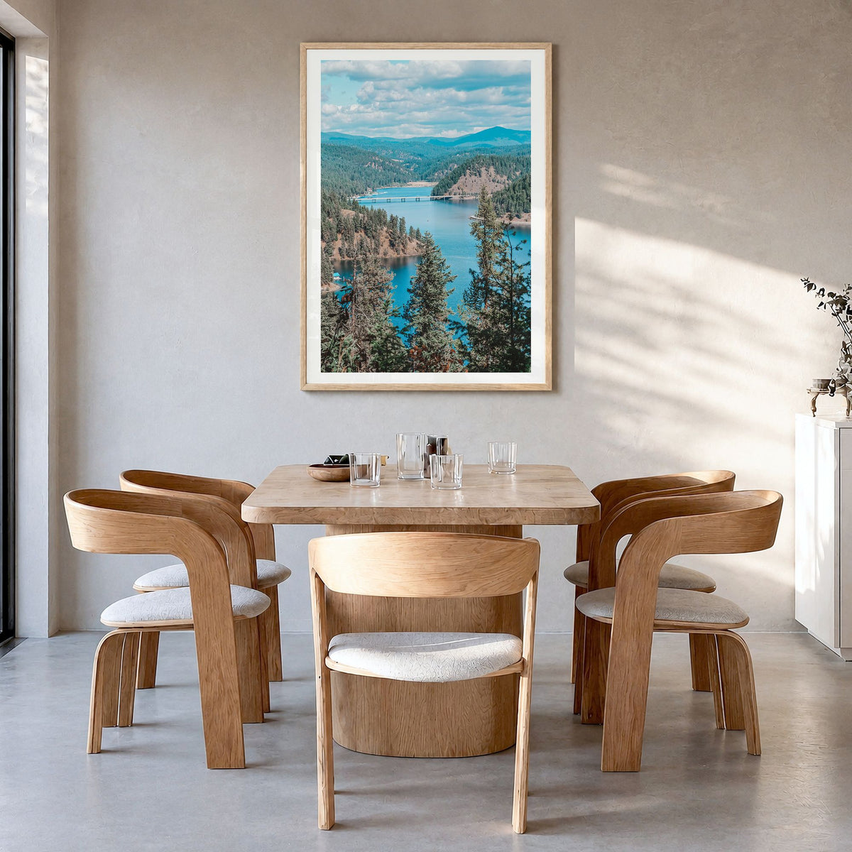 Coeur d'Alene Photo Poster in a natural wood frame, hanging in a dining room, white border