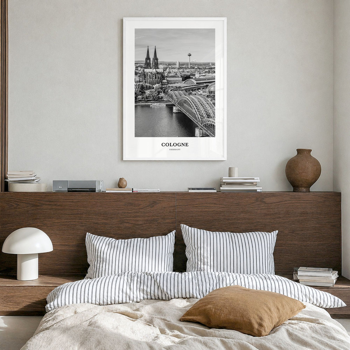 Cologne Classic Poster in a white wood frame, hanging in a bedroom