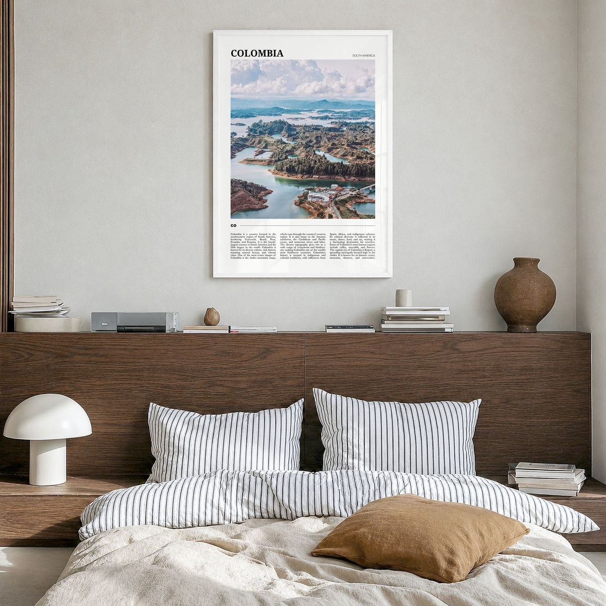 Colombia Travel No 2 Poster in a white wood frame, hanging in a bedroom