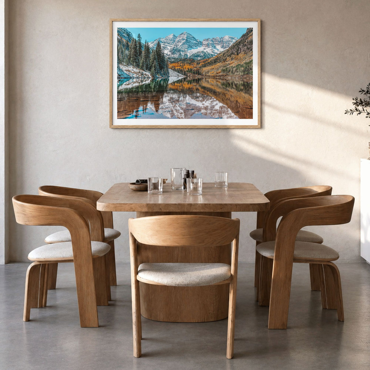 Colorado Photo Poster in a natural wood frame, hanging in a dining room, white border