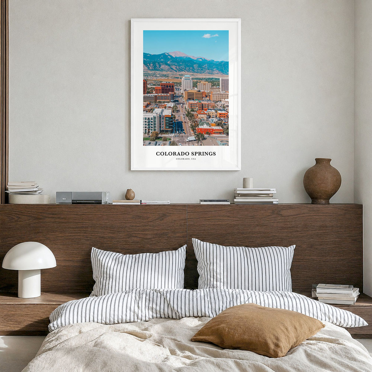 Colorado Springs Classic Poster in a white wood frame, hanging in a bedroom