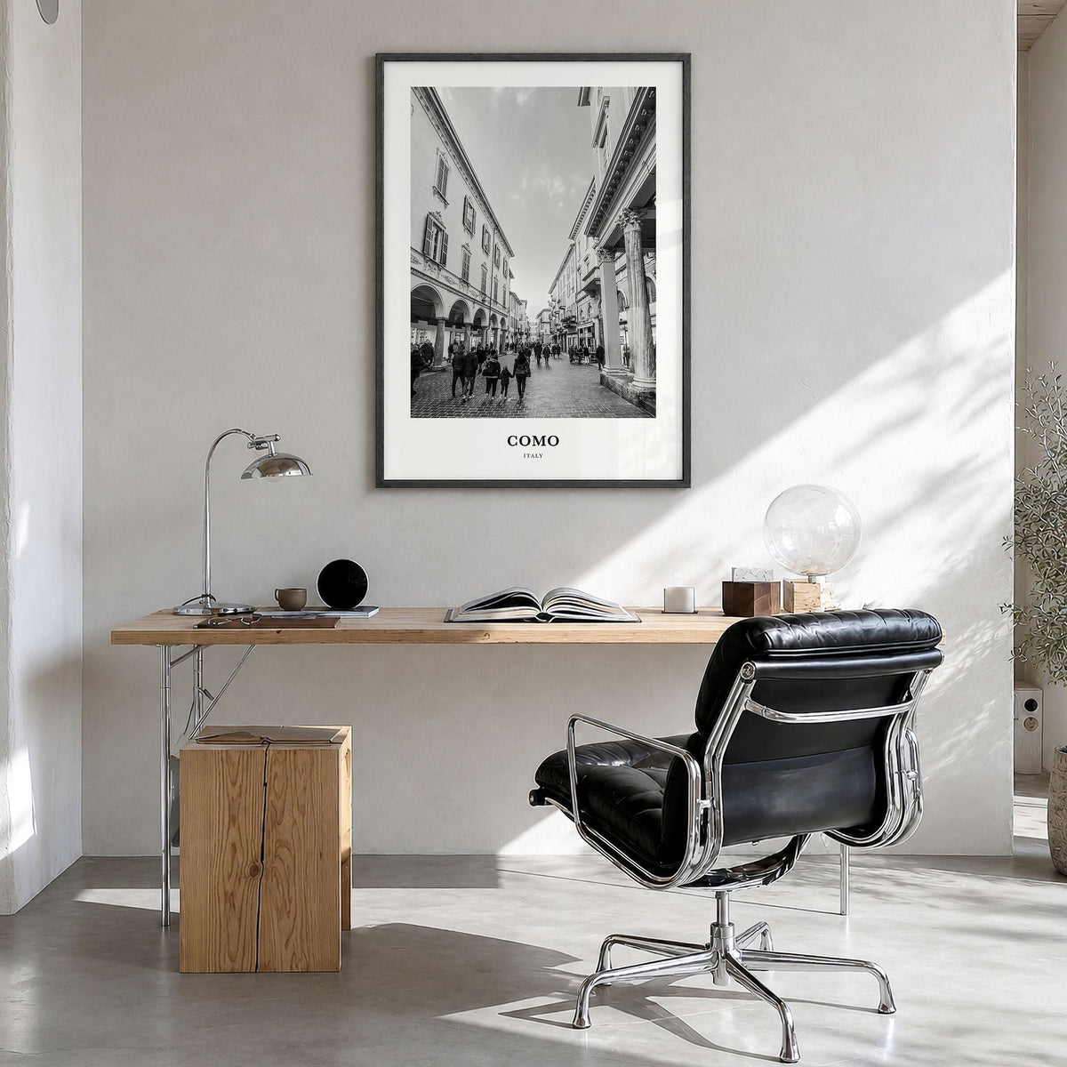 Como Classic No 2 Poster in a black wood frame, hanging in a bright home office