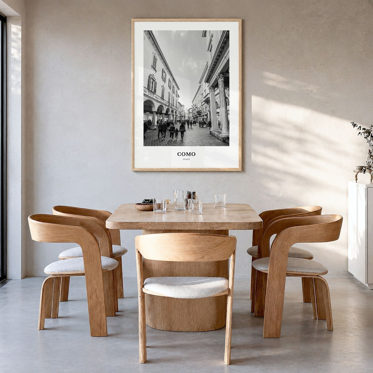 Como Classic No 2 Poster in a natural wood frame, hanging in a dining room