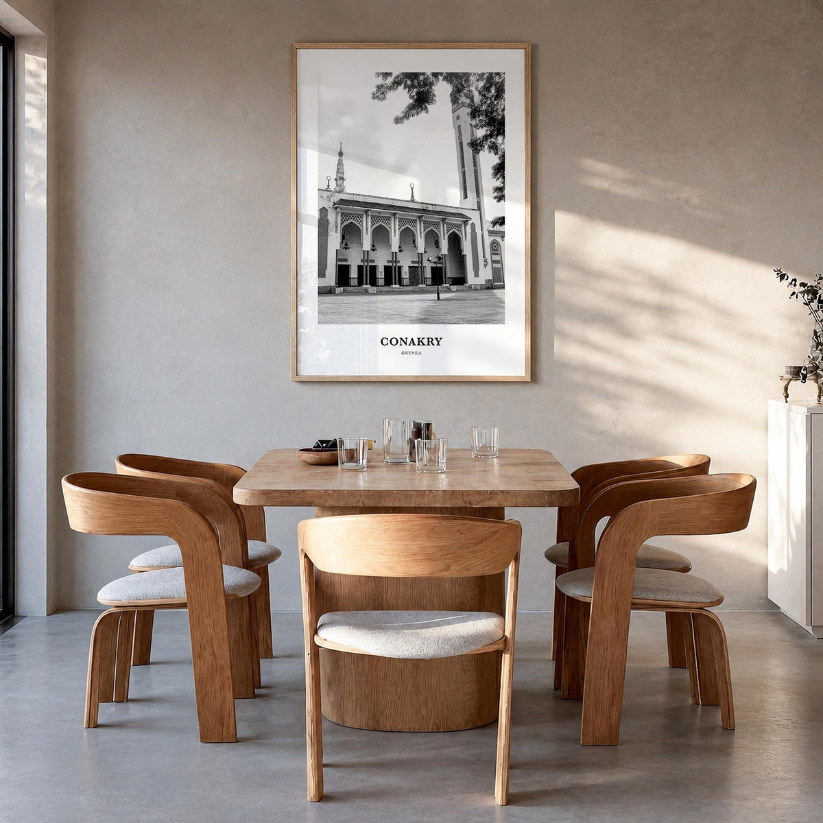 Conakry black & white classic poster of Guinea – vertical wall art in natural wood frame, hanging on wall