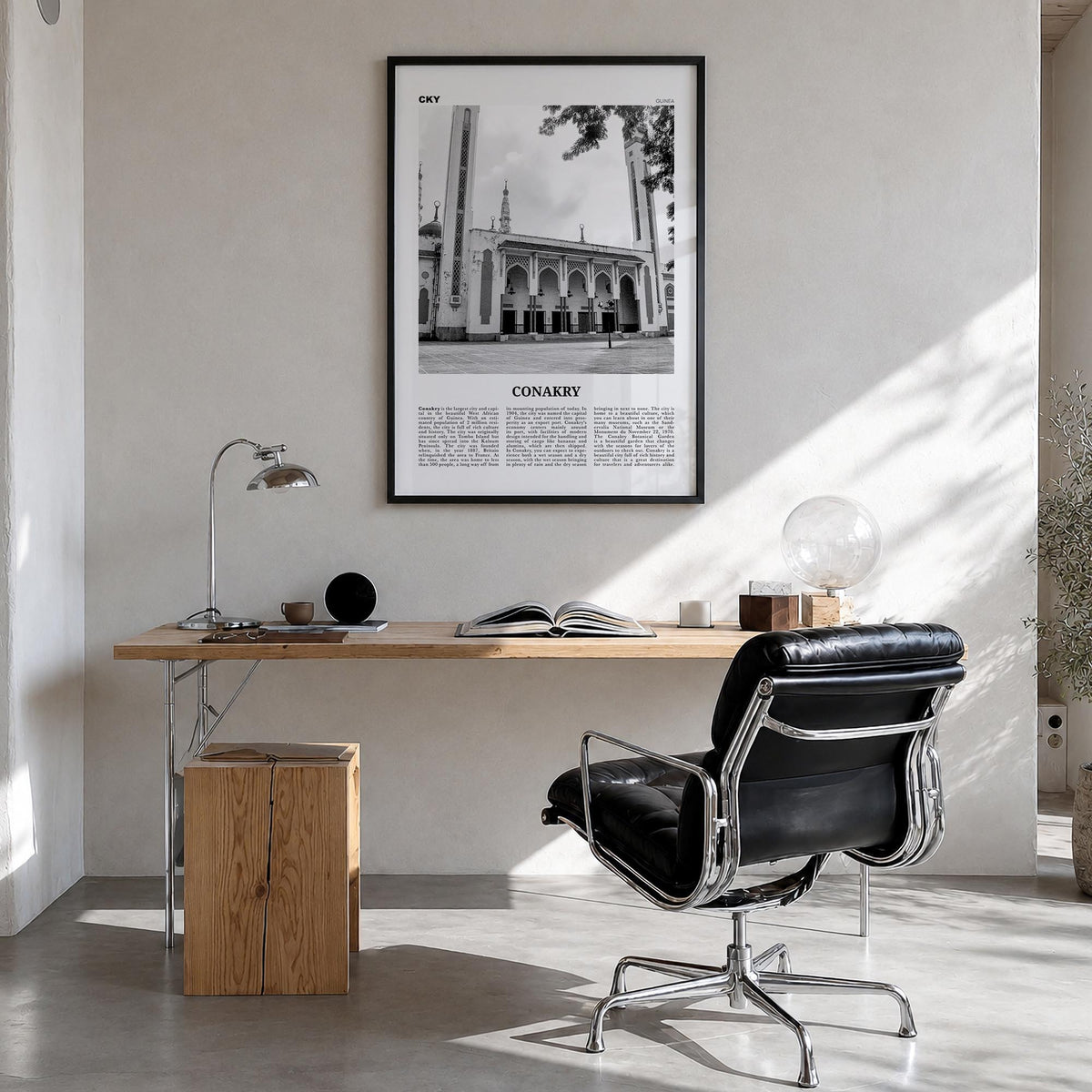 Conakry black & white newspaper poster of Guinea – vertical wall art in black wood frame, hanging on wall