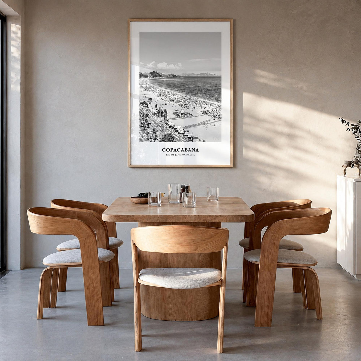 Copacabana black & white classic poster of Rio de Janeiro, Brazil – vertical wall art in natural wood frame, hanging on wall