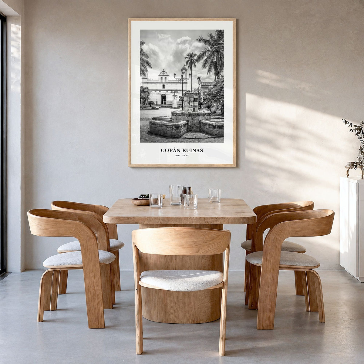 Copán Ruinas Classic Poster in a natural wood frame, hanging in a dining room