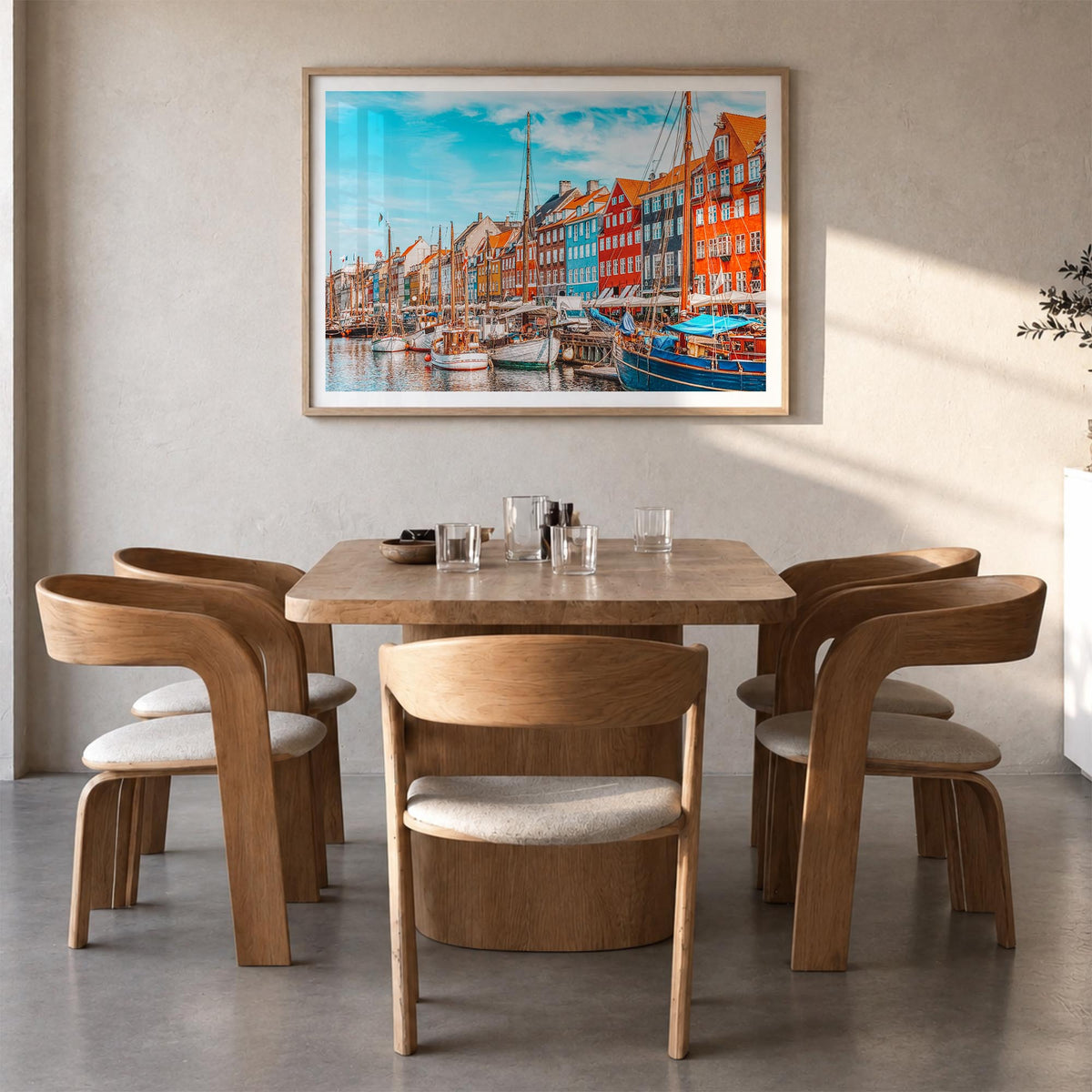 Copenhagen colorful photo poster of Denmark – horizontal wall art in natural wood frame with white border, hanging on wall