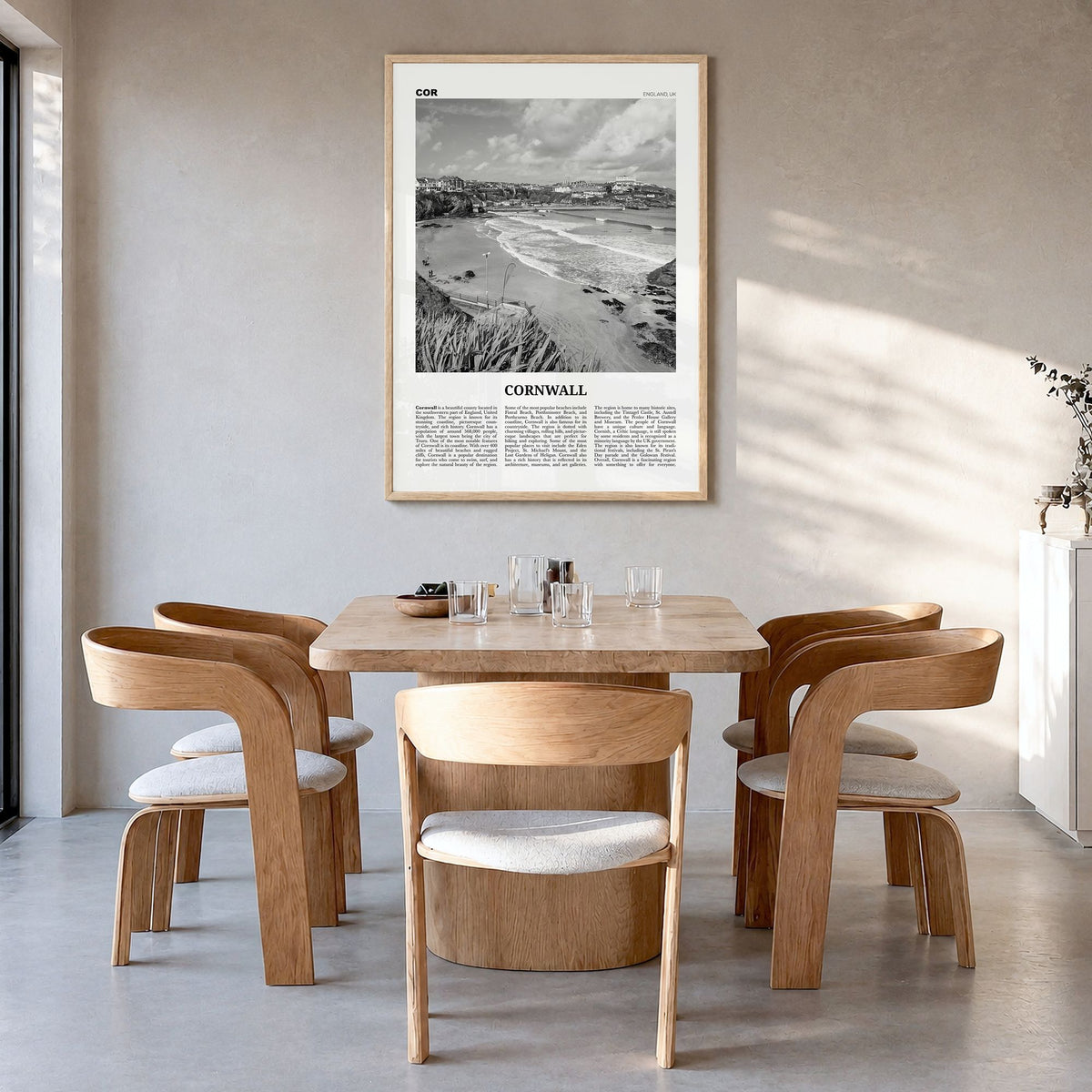 Cornwall Newspaper Poster in a natural wood frame, hanging in a dining room