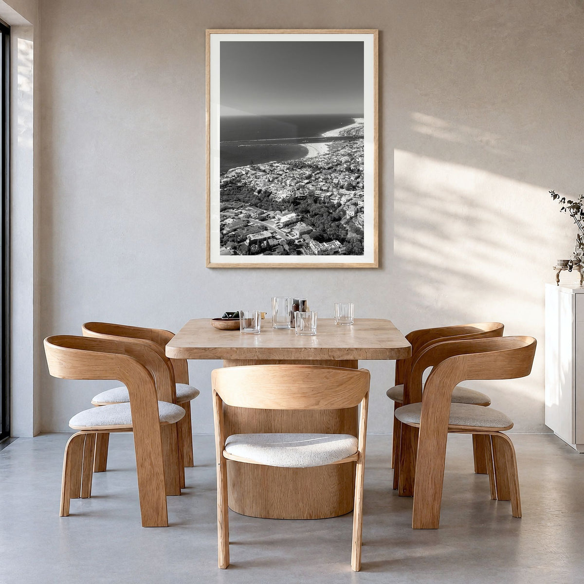 Corona del Mar Photo Poster in a natural wood frame, hanging in a dining room, white border