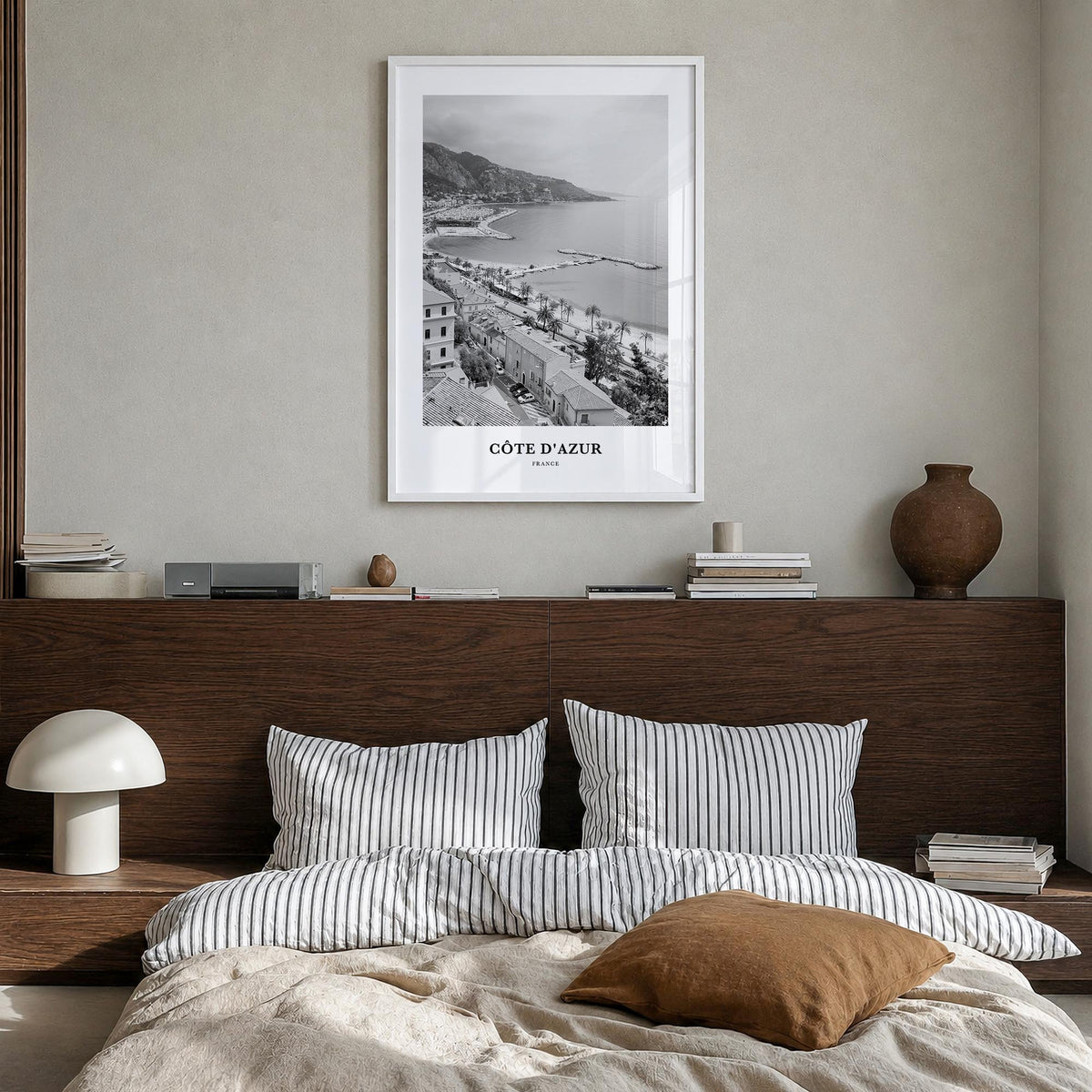 Côte d'Azur black & white classic poster of France – vertical wall art in white wood frame, hanging on wall