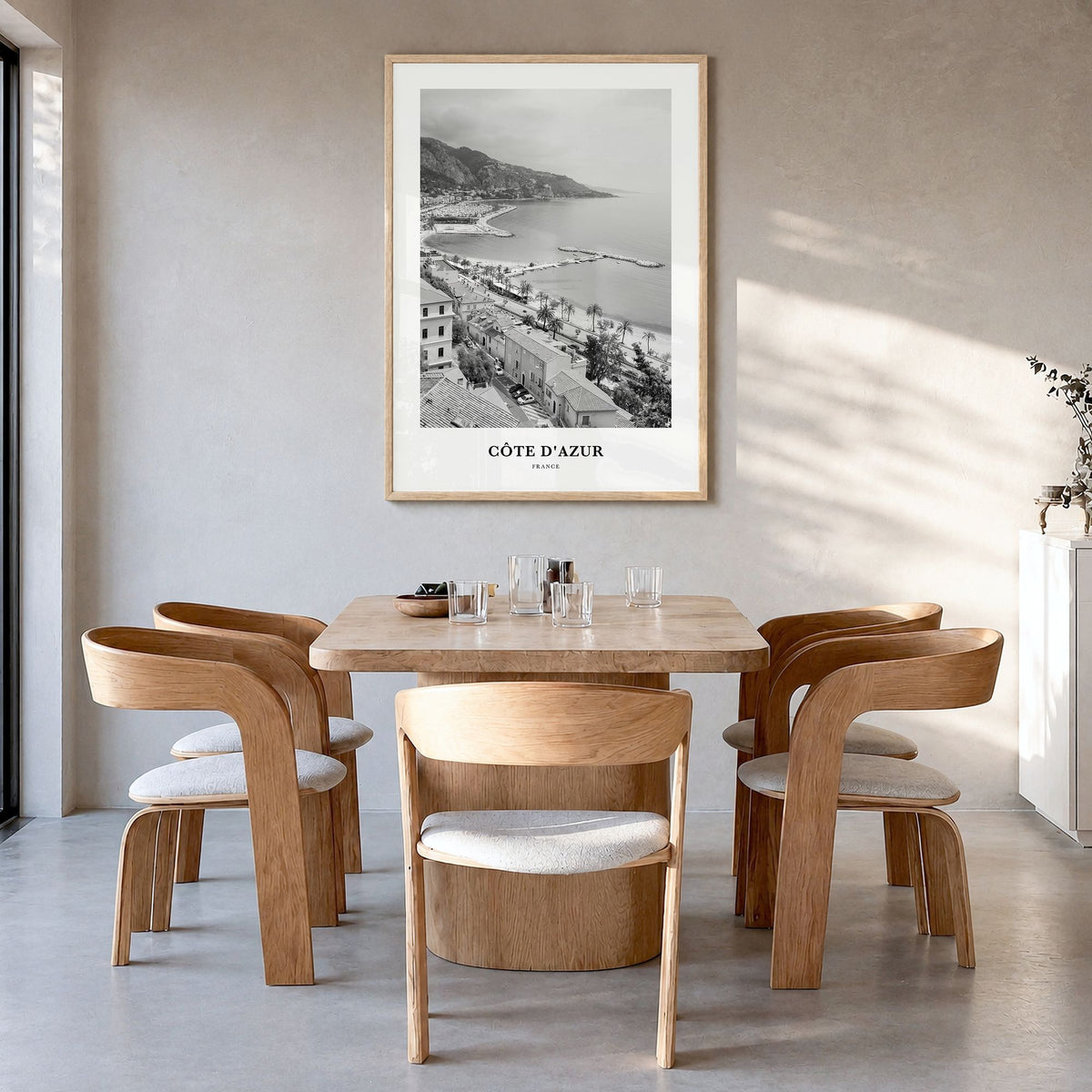 Côte d'Azur Classic Poster in a natural wood frame, hanging in a dining room