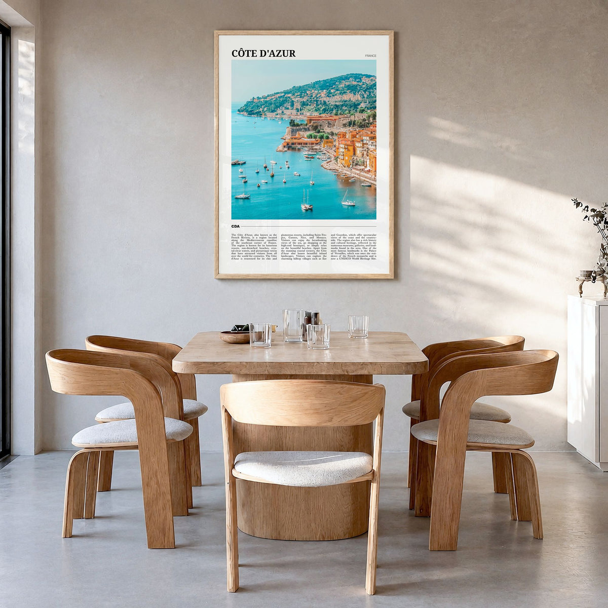 Côte d'Azur Travel No 2 Poster in a natural wood frame, hanging in a dining room