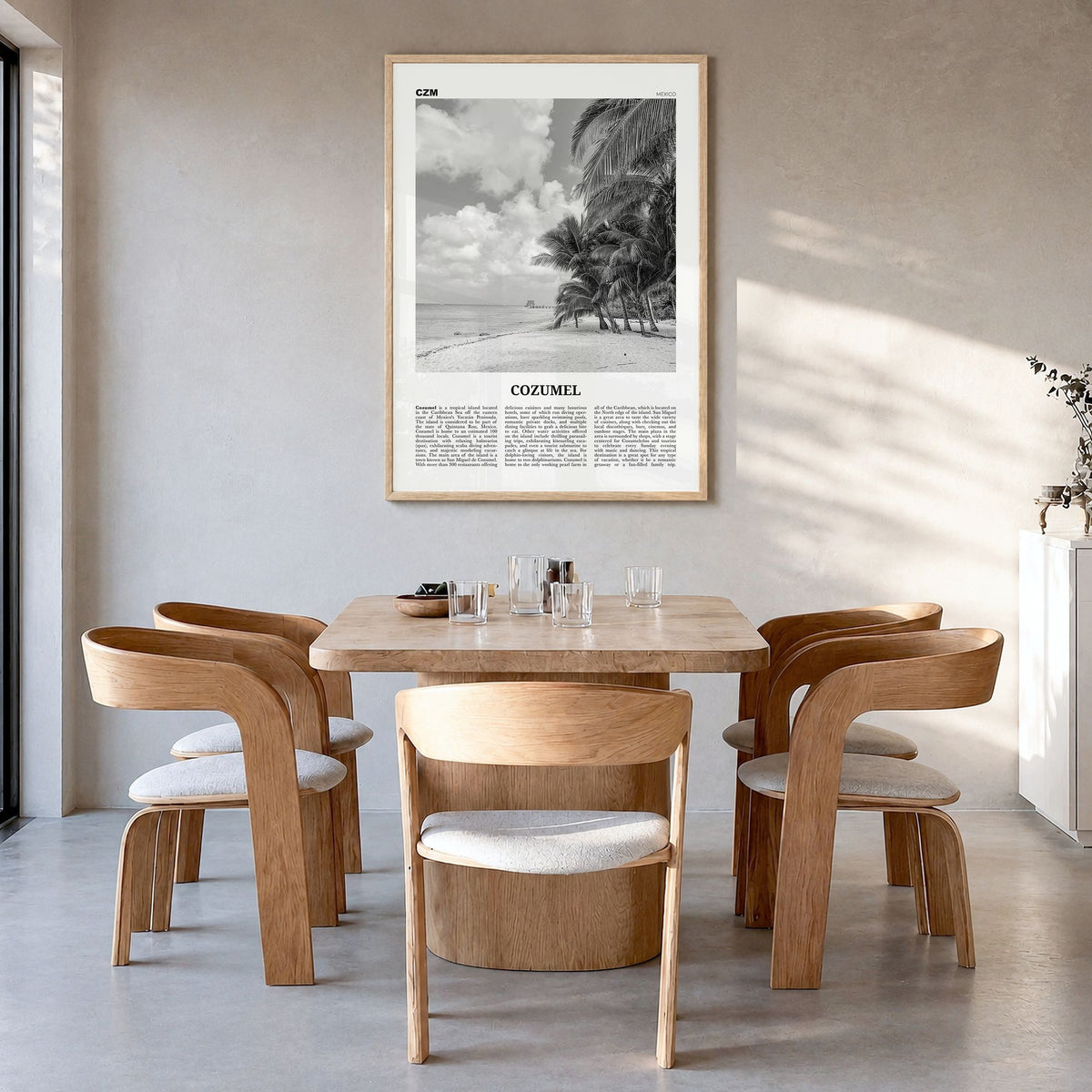 Cozumel Newspaper Poster in a natural wood frame, hanging in a dining room