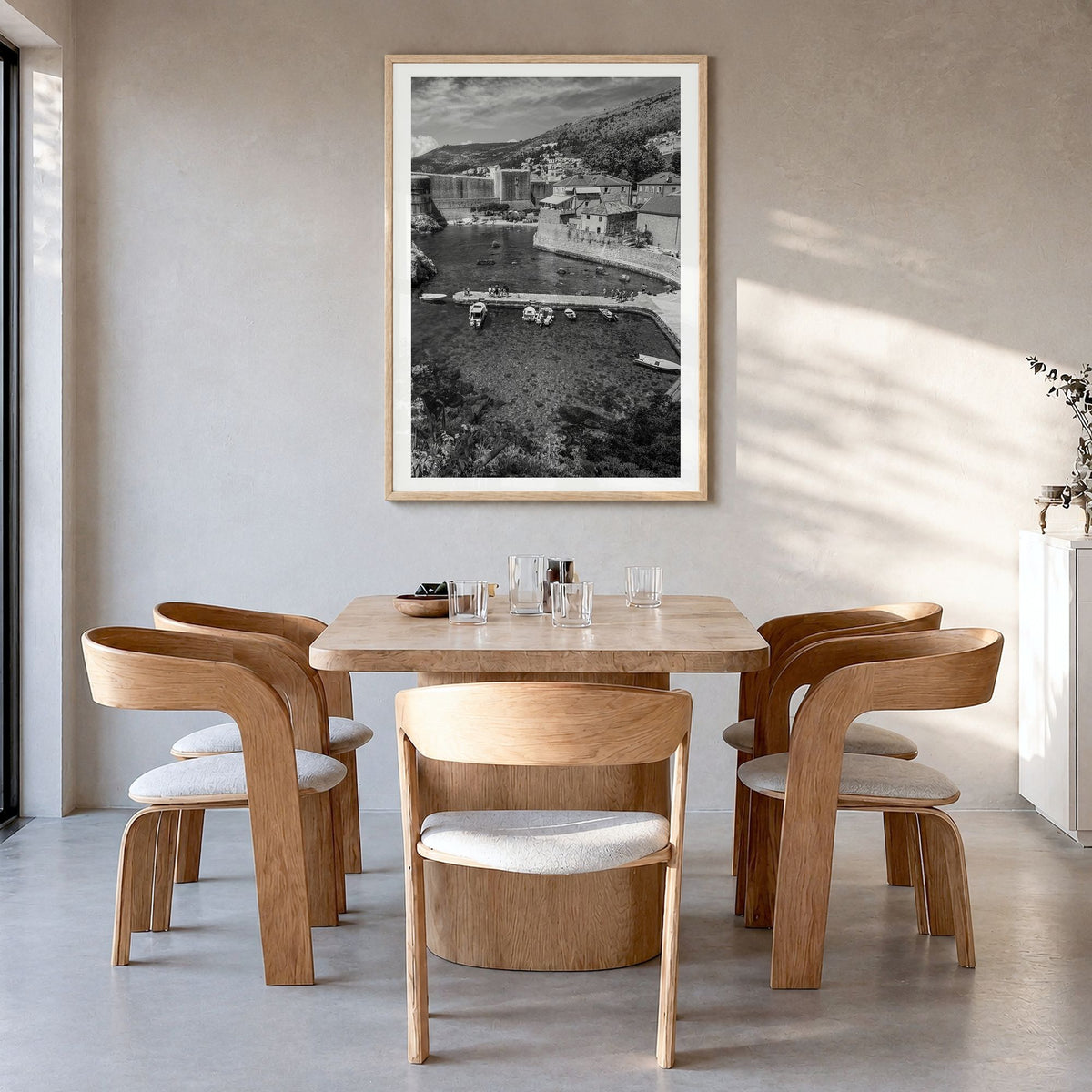 Croatia Photo Poster in a natural wood frame, hanging in a dining room, white border
