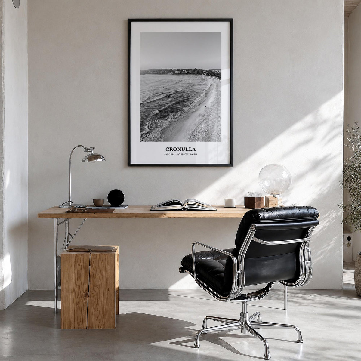 Cronulla black & white classic poster of Australia – vertical wall art in black wood frame, hanging on wall