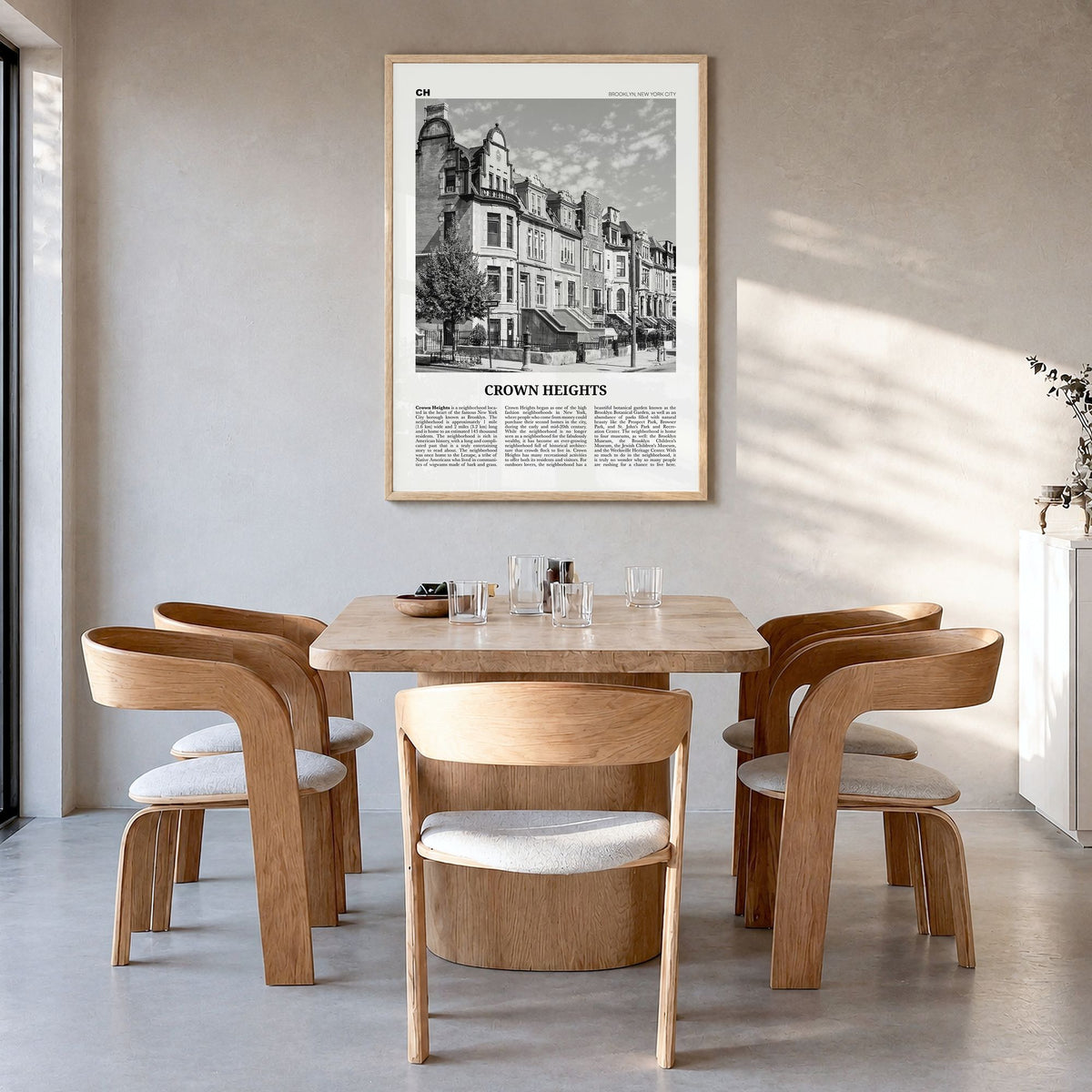 Crown Heights Newspaper Poster in a natural wood frame, hanging in a dining room