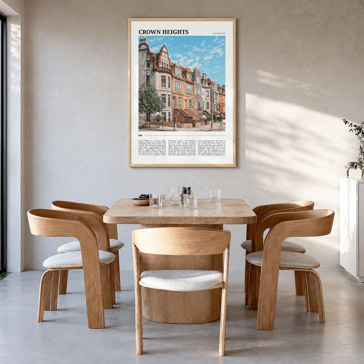 Crown Heights Travel Poster in a natural wood frame, hanging in a dining room