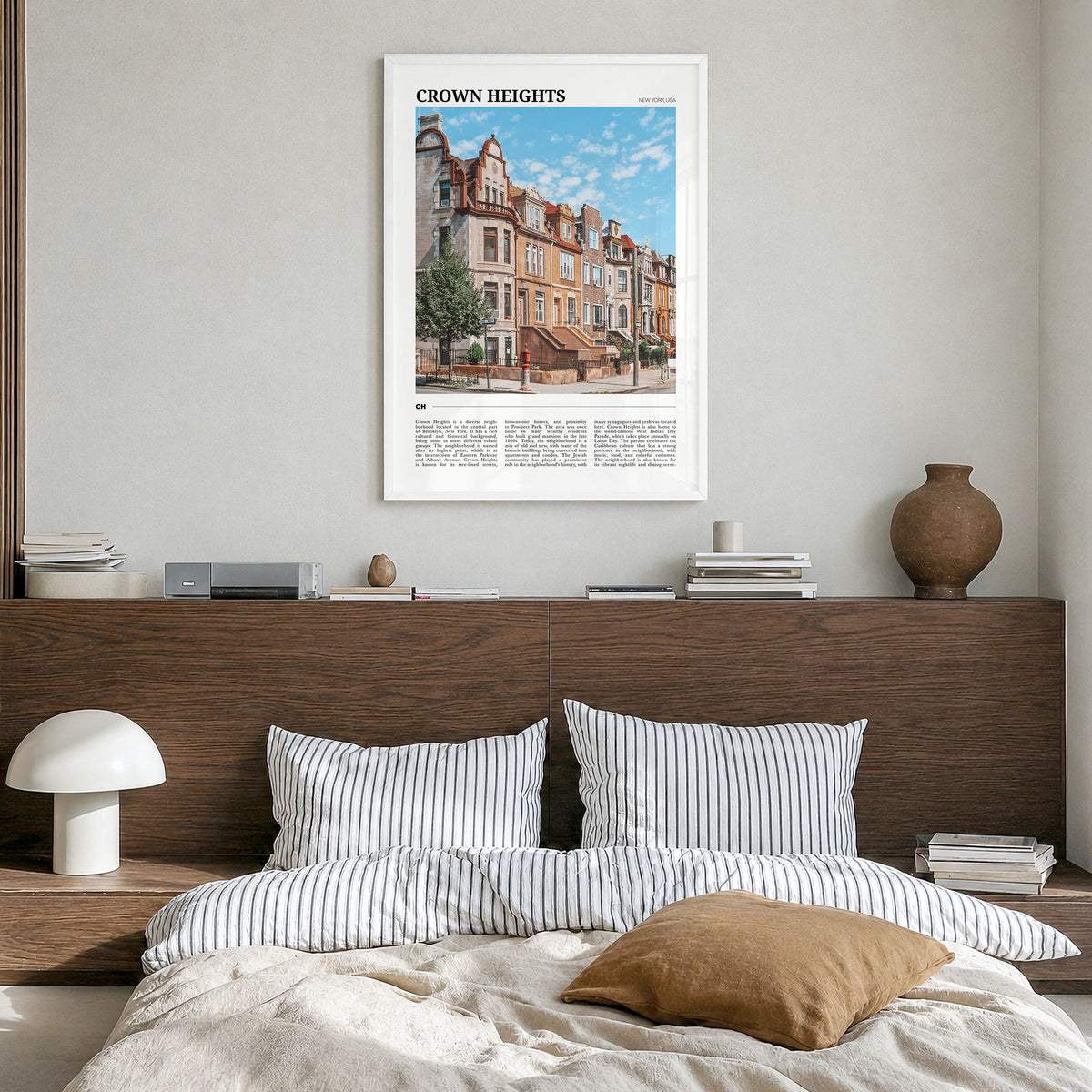 Crown Heights Travel Poster in a white wood frame, hanging in a bedroom