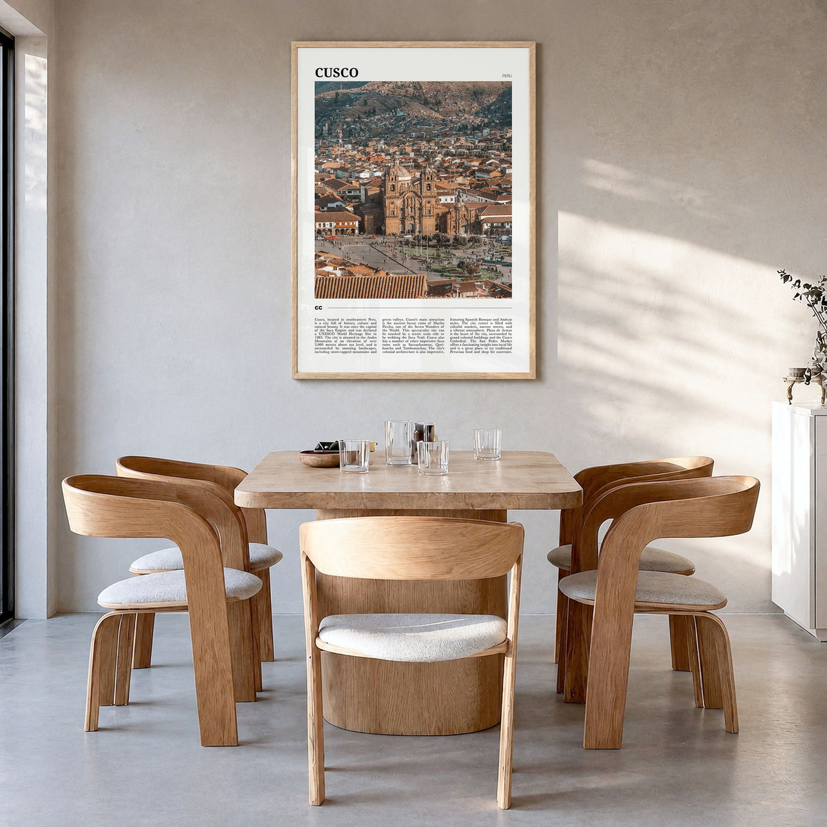 Cusco Travel Poster in a natural wood frame, hanging in a dining room