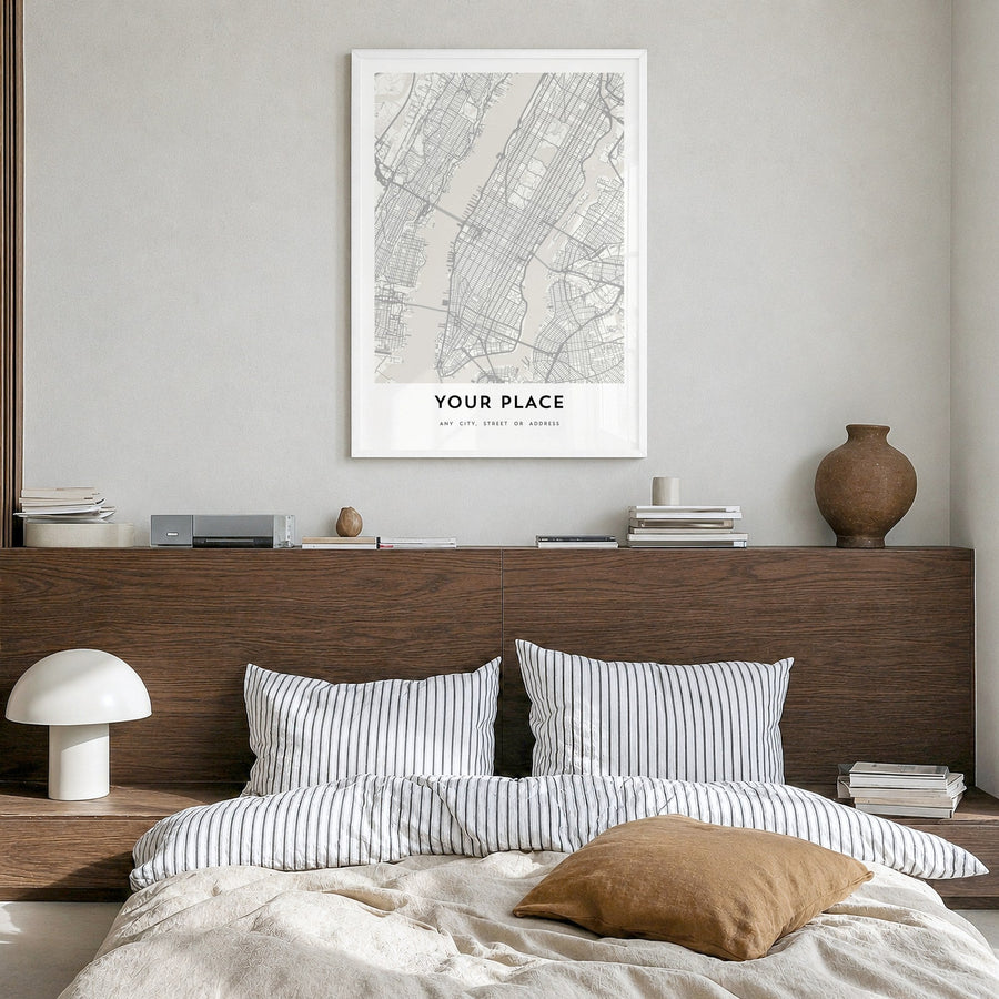 Custom Map Poster in Grey in a white wood frame, hanging in a bedroom