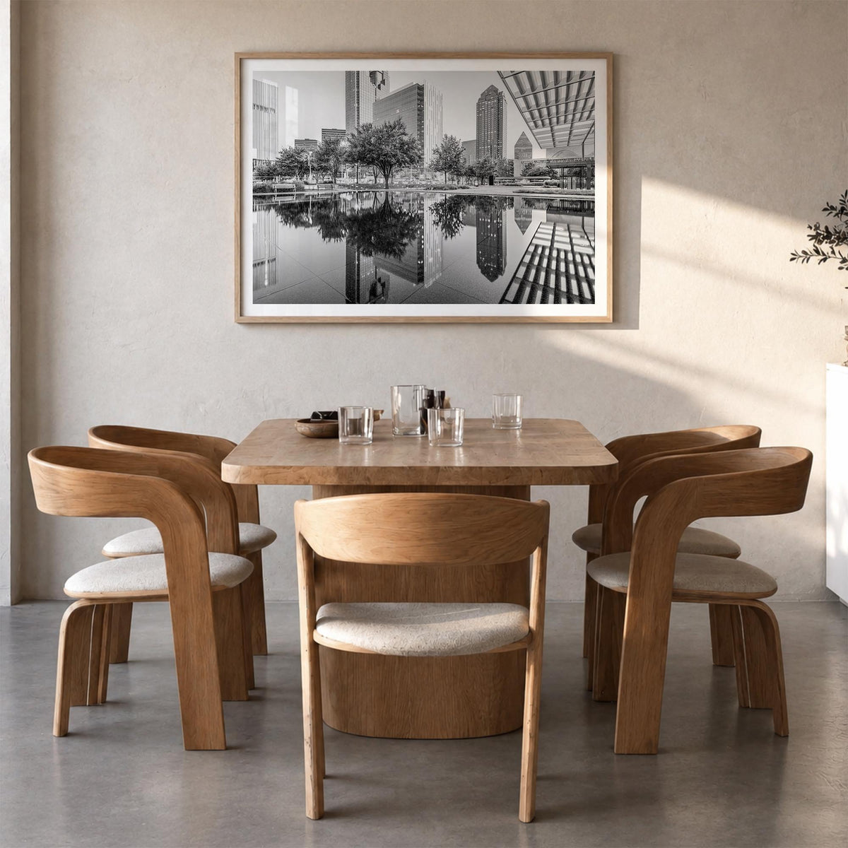 Dallas black & white photo poster of Texas, USA – horizontal wall art in natural wood frame with white border, hanging on wal