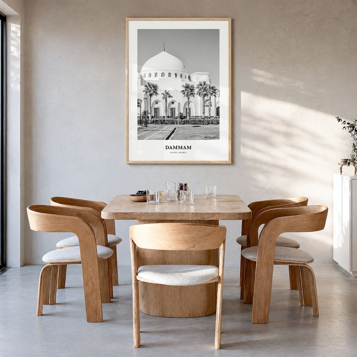 Dammam Classic Poster in a natural wood frame, hanging in a dining room