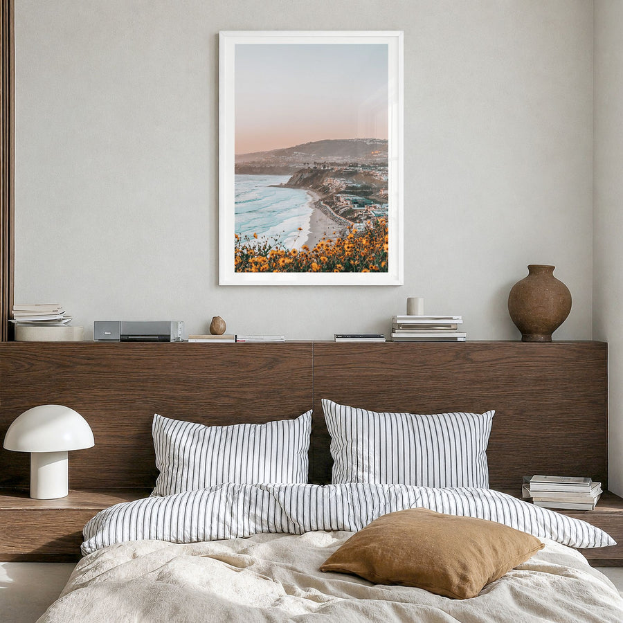 Dana Point Photo No 1 Poster in a white wood frame, hanging in a bedroom, white border