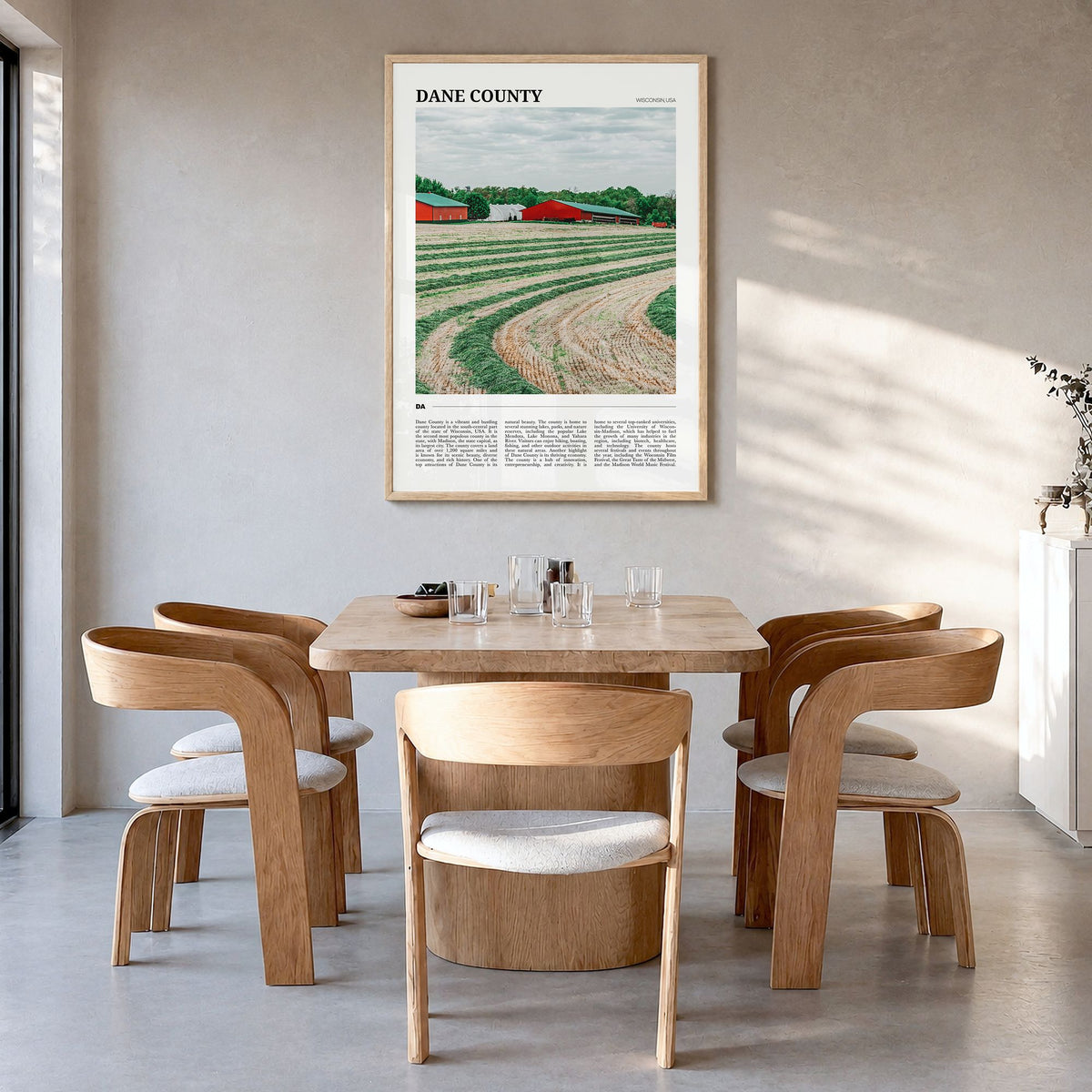 Dane County Travel Poster in a natural wood frame, hanging in a dining room