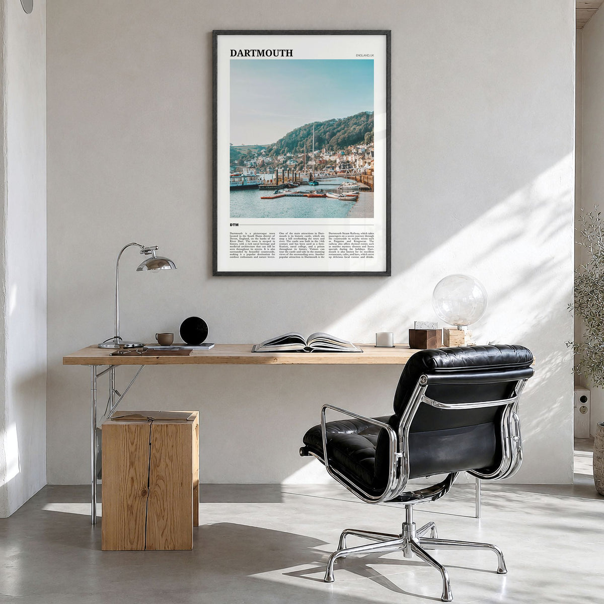 Dartmouth, England Travel Poster in a black wood frame, hanging in a bright home office