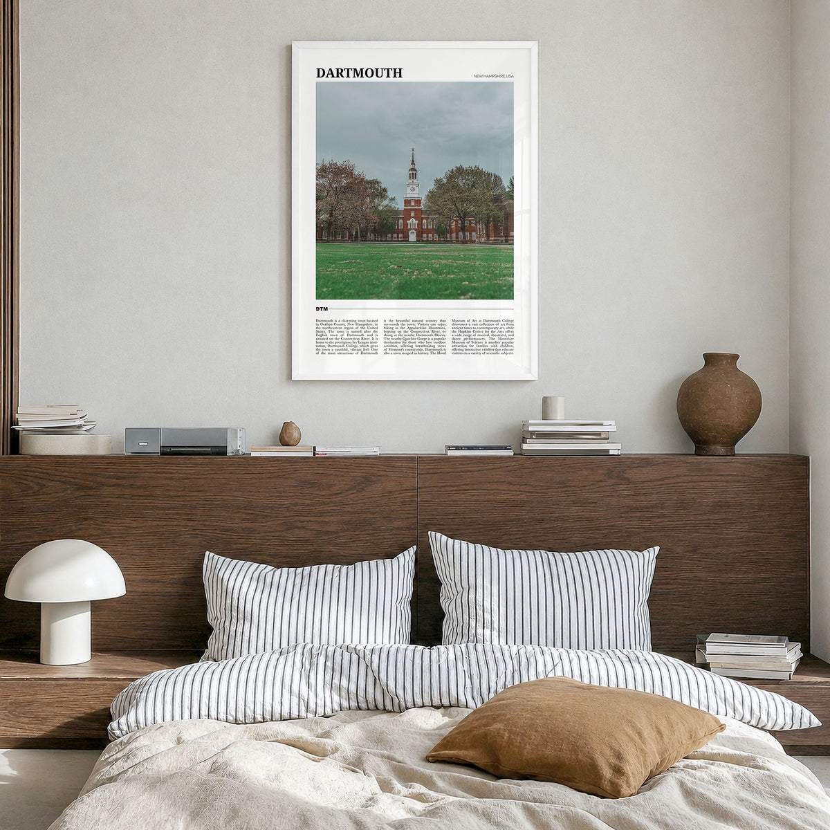 Dartmouth Travel Poster in a white wood frame, hanging in a bedroom