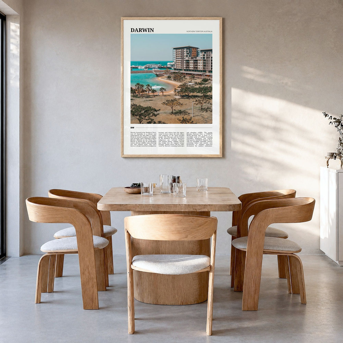 Darwin Travel Poster in a natural wood frame, hanging in a dining room
