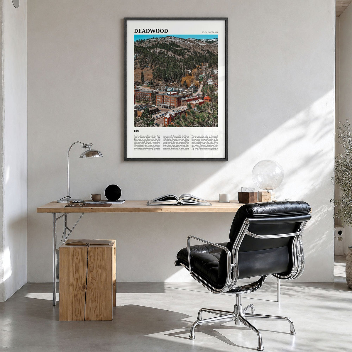 Deadwood Travel Poster in a black wood frame, hanging in a bright home office