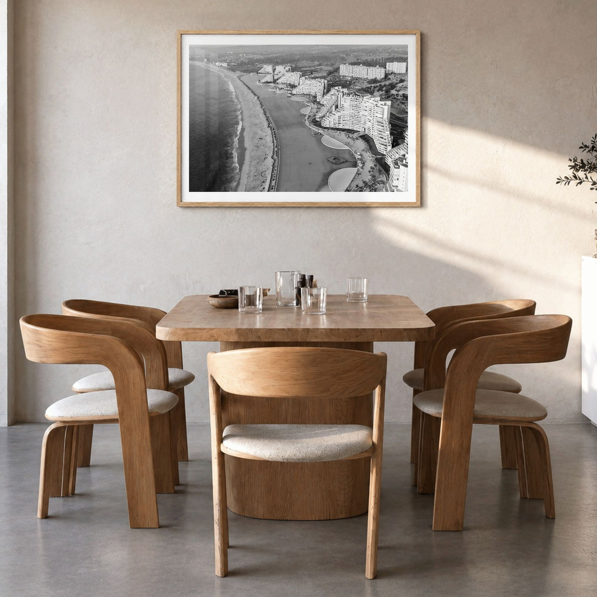 Del Mar Photo Poster in a natural wood frame, hanging in a dining room, white border