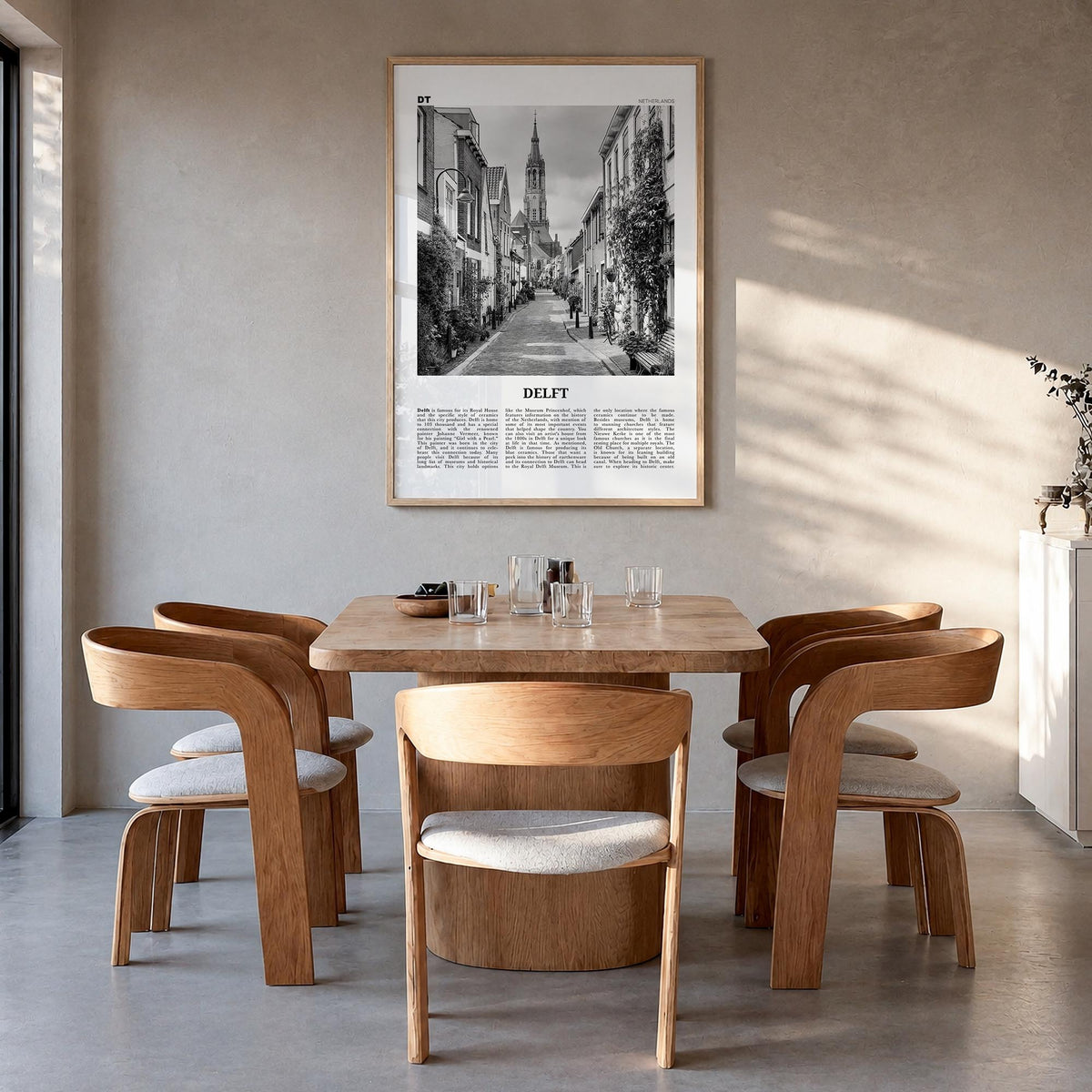 Delft black & white newspaper poster of Netherlands – vertical wall art in natural wood frame, hanging on wall
