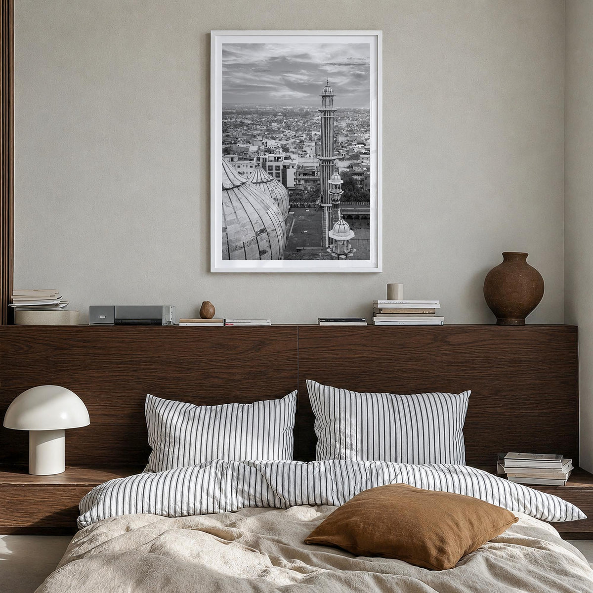 Delhi black & white photo poster of India – vertical wall art in white wood frame with white border, hanging on wall