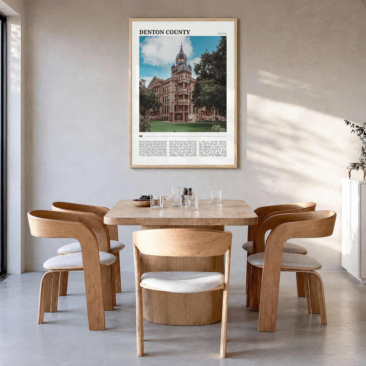 Denton County Travel Poster in a natural wood frame, hanging in a dining room