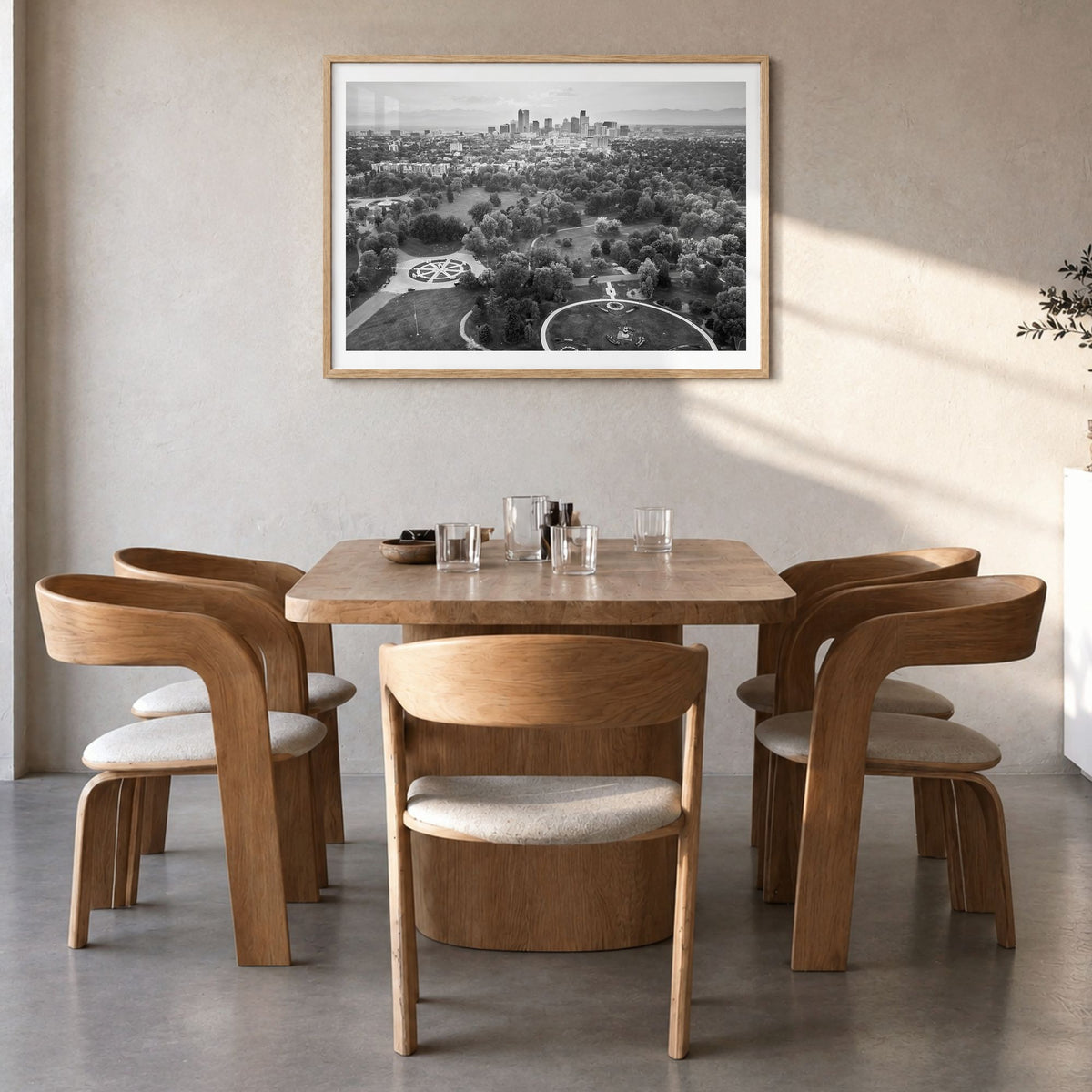 Denver Photo Poster in a natural wood frame, hanging in a dining room, white border
