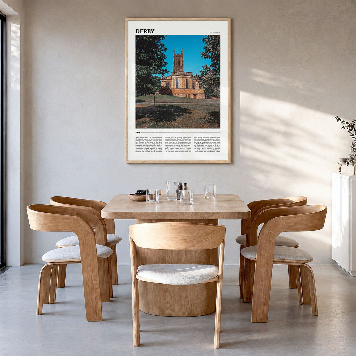 Derby Travel Poster in a natural wood frame, hanging in a dining room